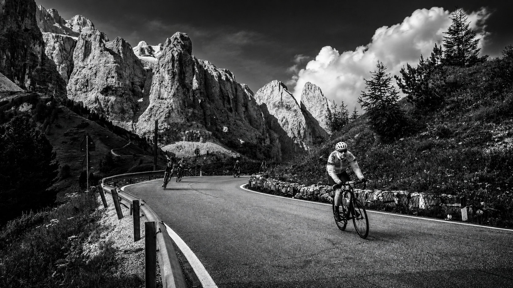 Cyclist ascending a Swiss mountain pass
